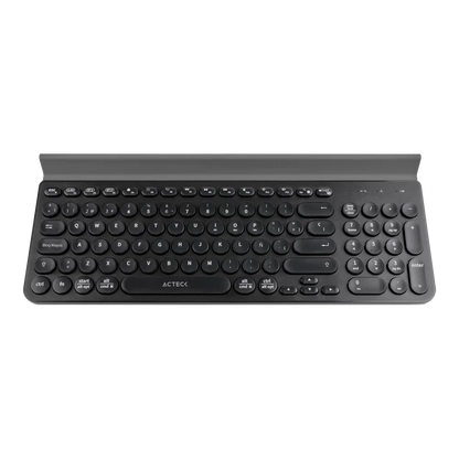 Teclado Acteck Inspire Comp TI695 — Inalámbrico Dual, multidispositivo, con 97 teclas y distribución en español, teclas multifunción y ranura para dispositivos, color negro.